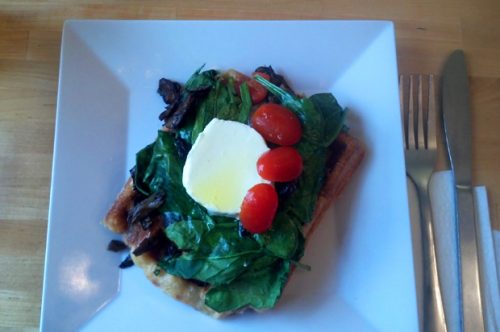 Mushroom, spinach, roasted pepper, tomato and chevre cheese on a waffle