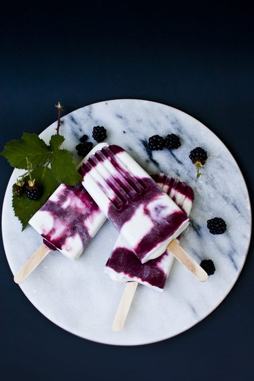 Combine blackberries, limes, and coconut milk to make these delicious popsicles.