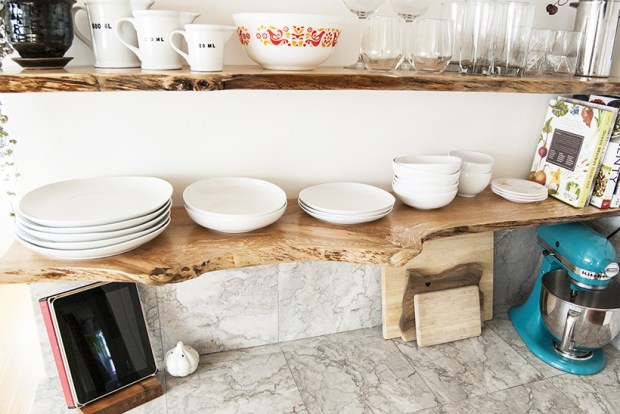 Kitchen makeover featuring floating, live-edge wood shelves