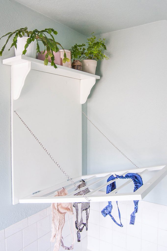 Make a DIY laundry rack with shelf. This combination drying rack and shelf gives you a bit of extra storage with your drying space.