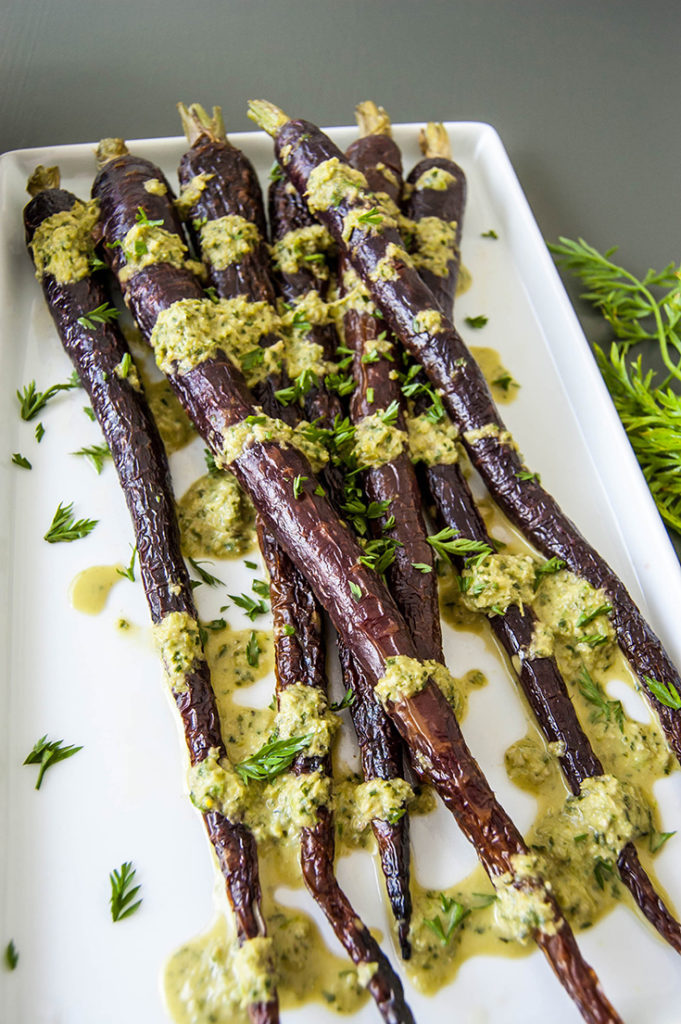 Roasted Carrots with Carrot Top and Garlic Scape Pesto - A great way to use produce you're not sure what to do with!