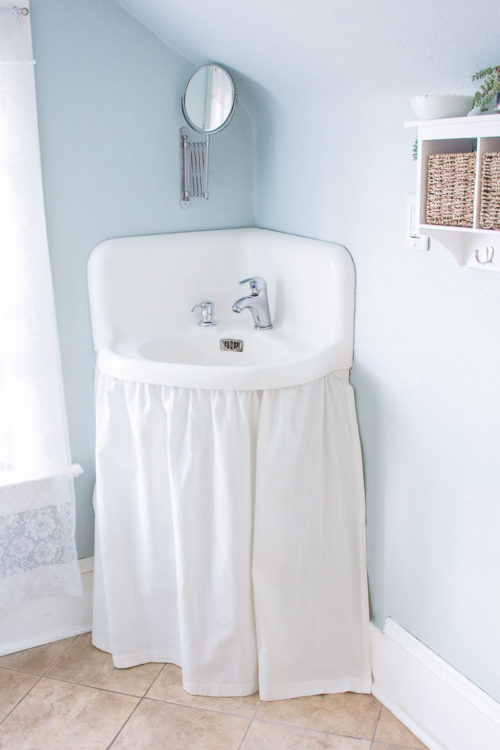 Salvaged vintage bathroom corner sink