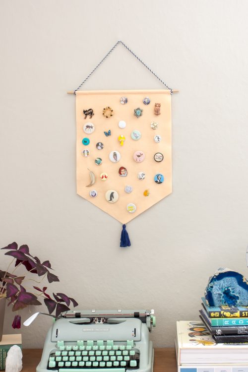 Your pin collection can double as wall art when you make this DIY pin storage banner.