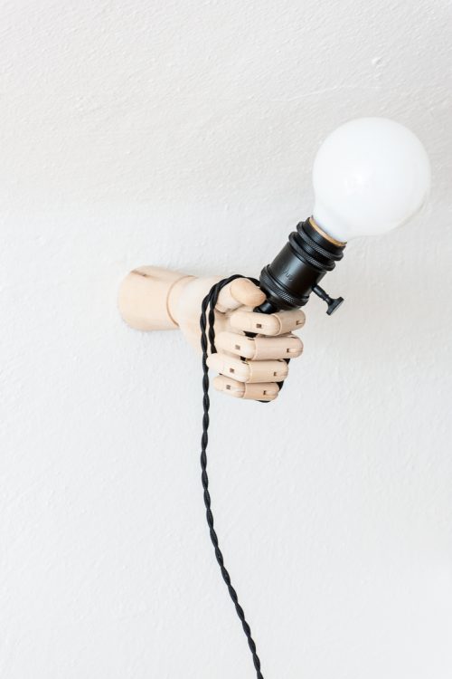 Make a playful DIY hand sconce light fixture to hold your light. #decor #DIY #homedecor #home #lighting