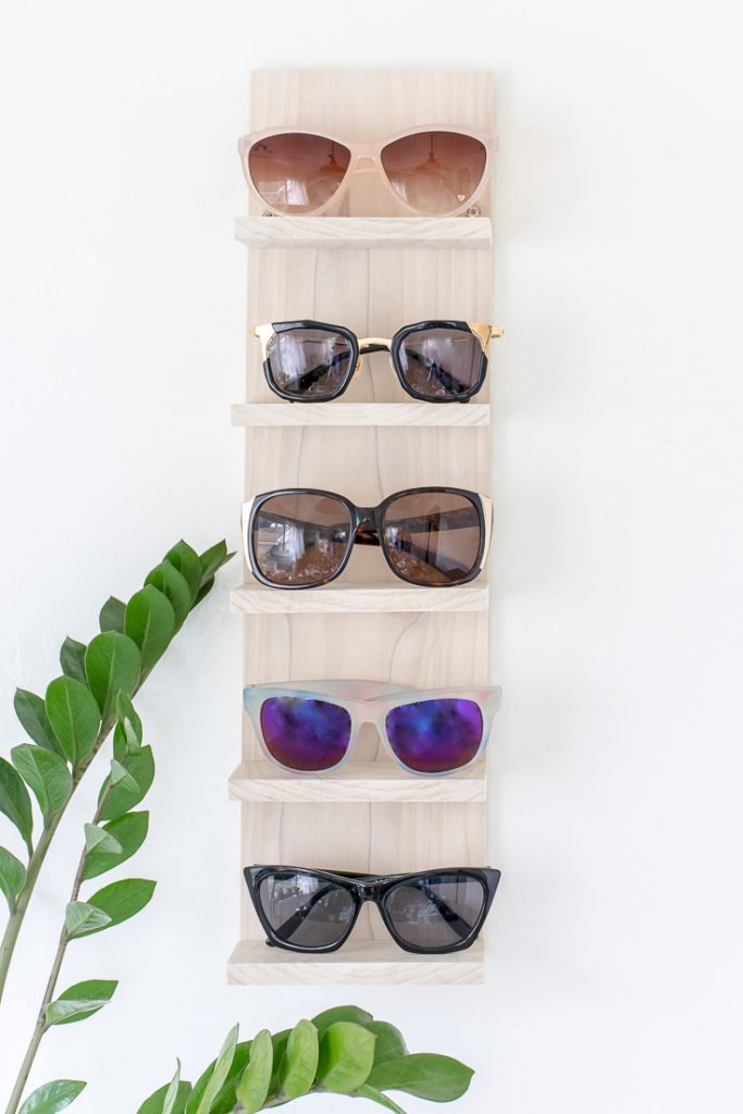 Is your sunglasses collection a mess? Make a DIY sunglasses organizer to display them in style. #DIY #sunglasses #sunglass #display #organize #organizer