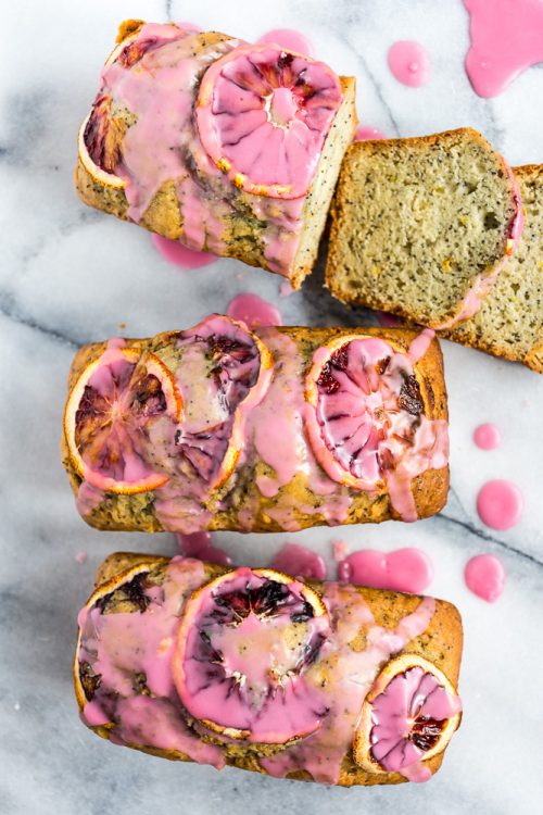 Vegan blood orange poppyseed loaf cake is a showstopper with that pretty pink icing. #vegan #baking #eggfree #dairyfree #recipe