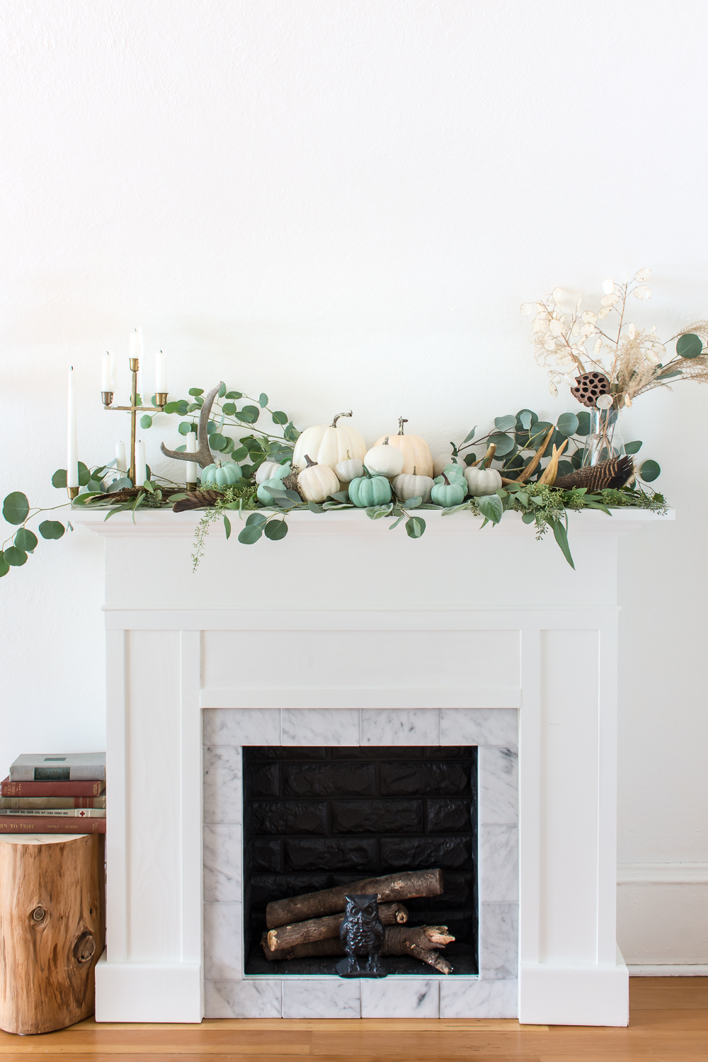Fall mantel with eucalyptus, and white and jade pumpkins